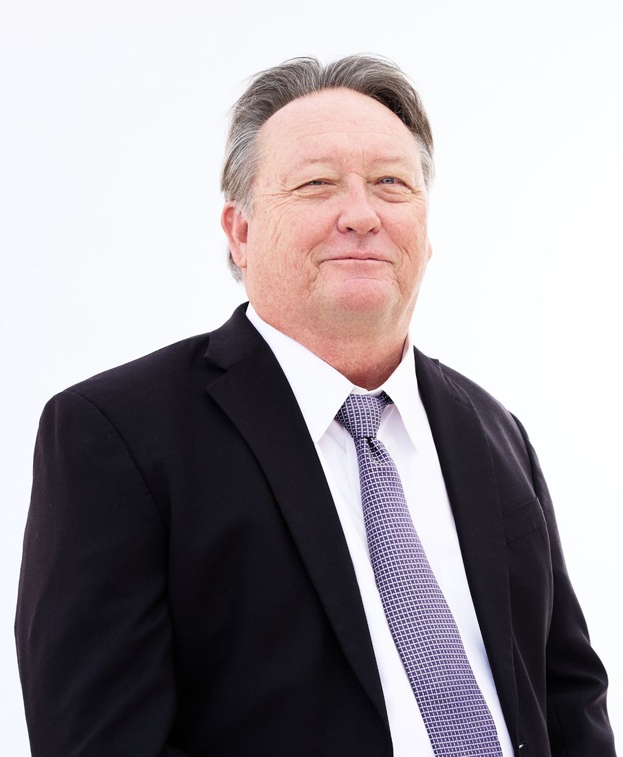 Kris Knutson, Las Cruces criminal defense attorney, in a dark suit and tie
